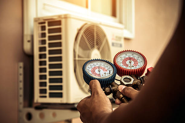 Professional Air Conditioning Service technician working in Rochester, KY